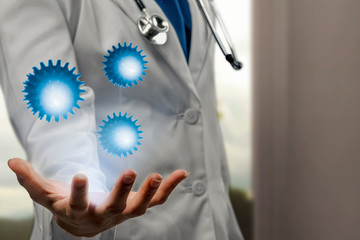 Doctor man with stethoscope showing virtual coronavirus on his hand