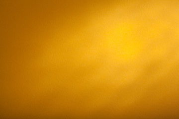 Fototapeta premium a yellow background texture, top backlight. panorama