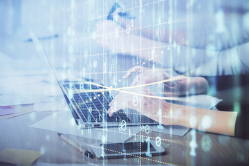 Multi exposure of woman hands working on computer and data theme hologram drawing. Tech concept.