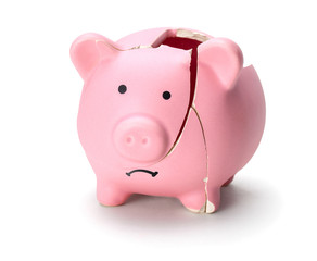 Broken piggy bank isolated on white background