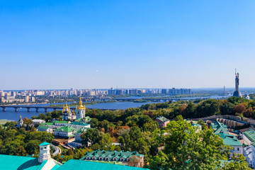 Fototapeta premium View of Kiev Pechersk Lavra (Kiev Monastery of the Caves), Motherland Monument and the Dnieper river in Ukraine. View from Great Lavra Bell Tower