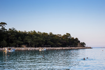 Kemer, Turkey / 08-28-2019. Yachts, sea vessels, boats and boats. The beaches of Kemer. Yachts on the background of mountains.