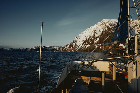 Morning sun and fishing boat in the arctic