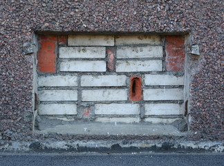 Basement window with bricks