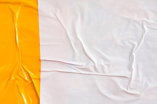 Orange and white crumpled glossy paper placard and poster texture background.