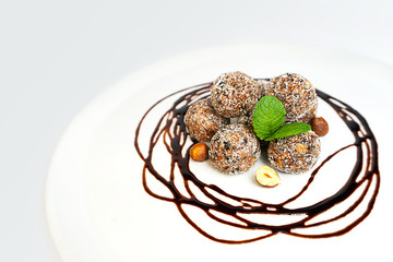 Energy balls or energy bites with oat, chocolate and coconut.