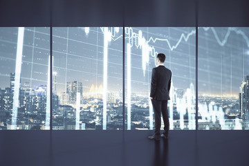 Fototapeta na wymiar Thinking businessman standing near economic crisis stock charts