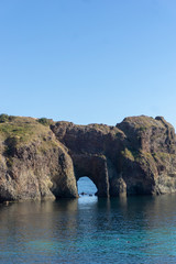 
stone arch on the coast