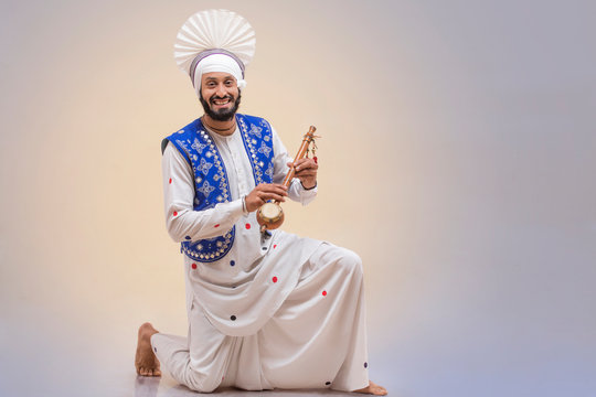 Portrait Of Sikh Man Doing Bhangra Dance
