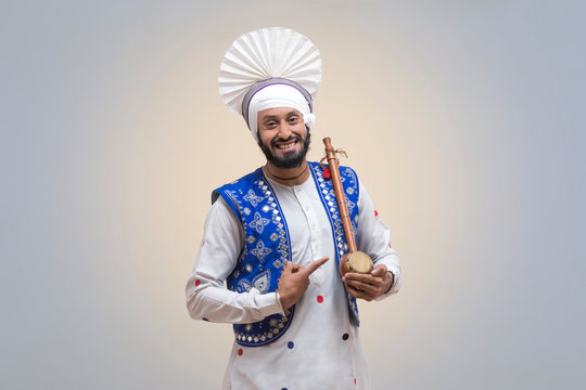 Standing Of Sikh man with Tumbi
