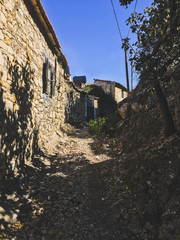 old stone houses on the street in the village 