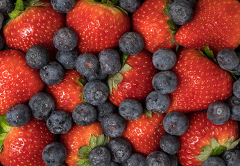 Fresh summer berries, blueberries and strawberries.