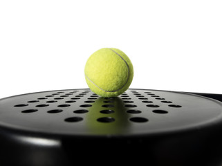 Isolated on white paddle tennis ball on racket