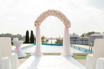 Fototapeta na wymiar wedding decor, arch, and floristry, visiting ceremonies, details, rings