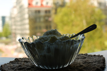 White ice cream with coconut in a glass plate