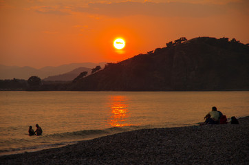 FETHIYE, TURKEY - June, 2019: Sunset on the Calis Beach on the Aegean Sea