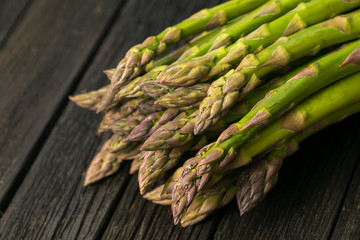 Bunch of fresh asparagus on wooden table