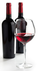 Red wine on white background.