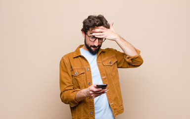 young cool man using his smart telephone