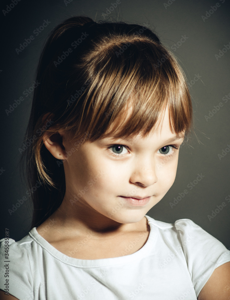 Wall mural cheerful and beautiful girl teenager in the studio