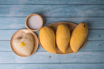 fresh ripe mango and sticky rice with coconut milk, authentic Thai dessert, popular traditional dessert of Thailand.