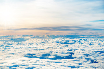 Fototapeta na wymiar Aerial view of blue sky with layers of white fluffy cumulus and cirrus clouds