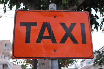 TAXI sign on the road
