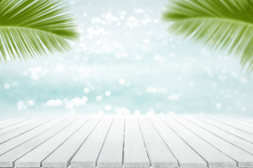 Tropical sea sand sun and white wood floor with palm leaves as frame Summer background concept