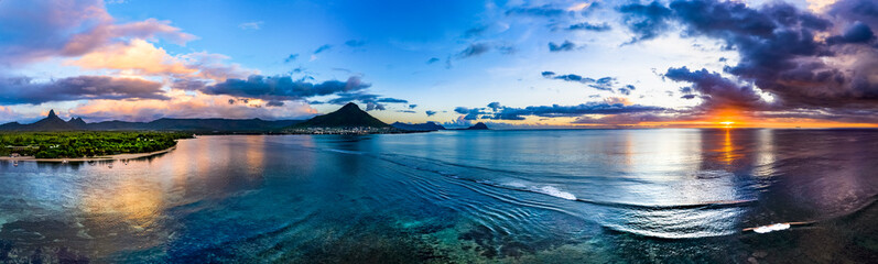 Aerial view: Sunset with thunderstorm on the coast of Flic en Flac, Mauritius, Africa