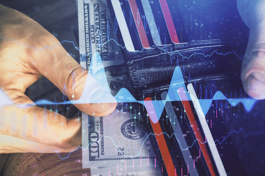 Multi exposure of forex graph drawing hologram and USA dollars bills and man hands. Technical Analysis concept.