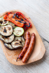 Assorted vegetables and sausages made on the grill