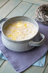 Milk soup with noodles and dough in a ceramic bowl
