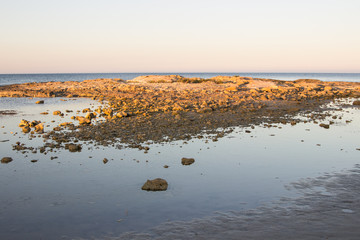 Rocks in a quiet and deserted beach
