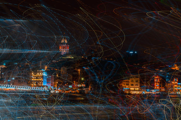 Abstract experimental surreal photo , long exposure, photo of city lights at night. Istanbul Night Life. Gallata tower and Istanbul neighborhoods. A view of a city at night. 