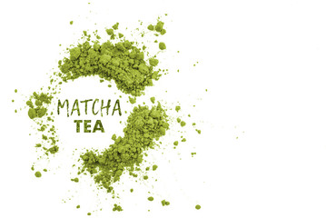 A pile of matcha green tea, powder explosion isolated on white background. Top view, copy space. Word matcha made of powdered matcha green tea. Japanese culture, high amount of antioxidants.