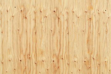 Fototapeta na wymiar hellbraune Holzwand an einem Bauzaun mit Astlöchern