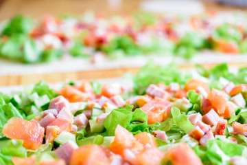 Green lettuce, cucumber, tomatoes and meat. Ingredients for the salad.
