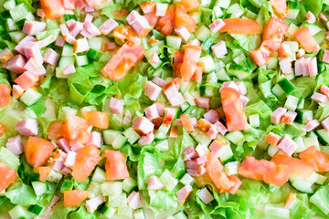 Green lettuce, cucumber, tomatoes and meat. Ingredients for the salad.