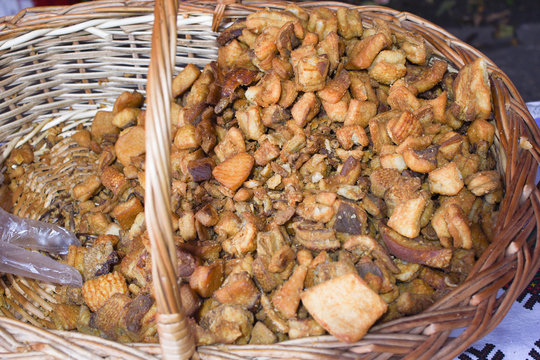 Jumari, delicious unhealthy fried pork greaves in a basket for sale.