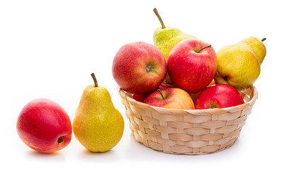 Apples and pears in a wicker basket. Isolate on a white background.
