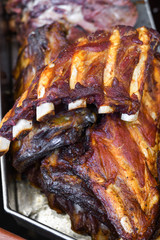 Marinated pork spare ribs, stack or pile of fresh grilled meat during barbeque, BBQ concept.