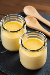 Homemade pudding on woode background - 手作りプリン