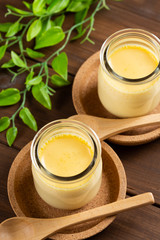 Homemade pudding on woode background - 手作りプリン