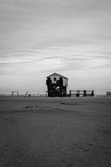 House on poles on the beach monochrome