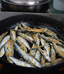 Freshly grilled fish on counter top stall, during seafood festival, street food market.