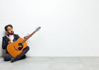 young man musician playing guitar 