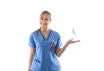 Nurse holding hand sanitizer or other product in palm of hand