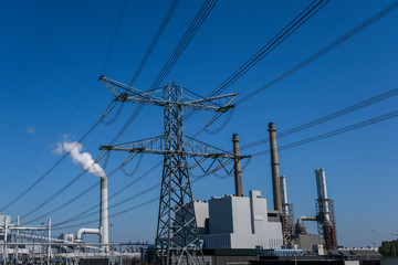 High-voltage power lines. Electricity distribution station. high voltage electric transmission tower. Distribution electric substation with power lines and transformers.
