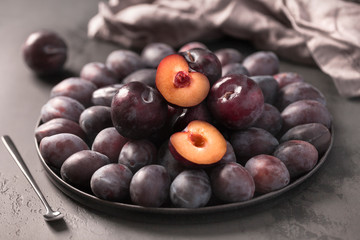 Delicious summer fresh plum on the plate