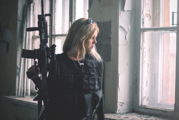 Special force agent girl with a rifle concept.